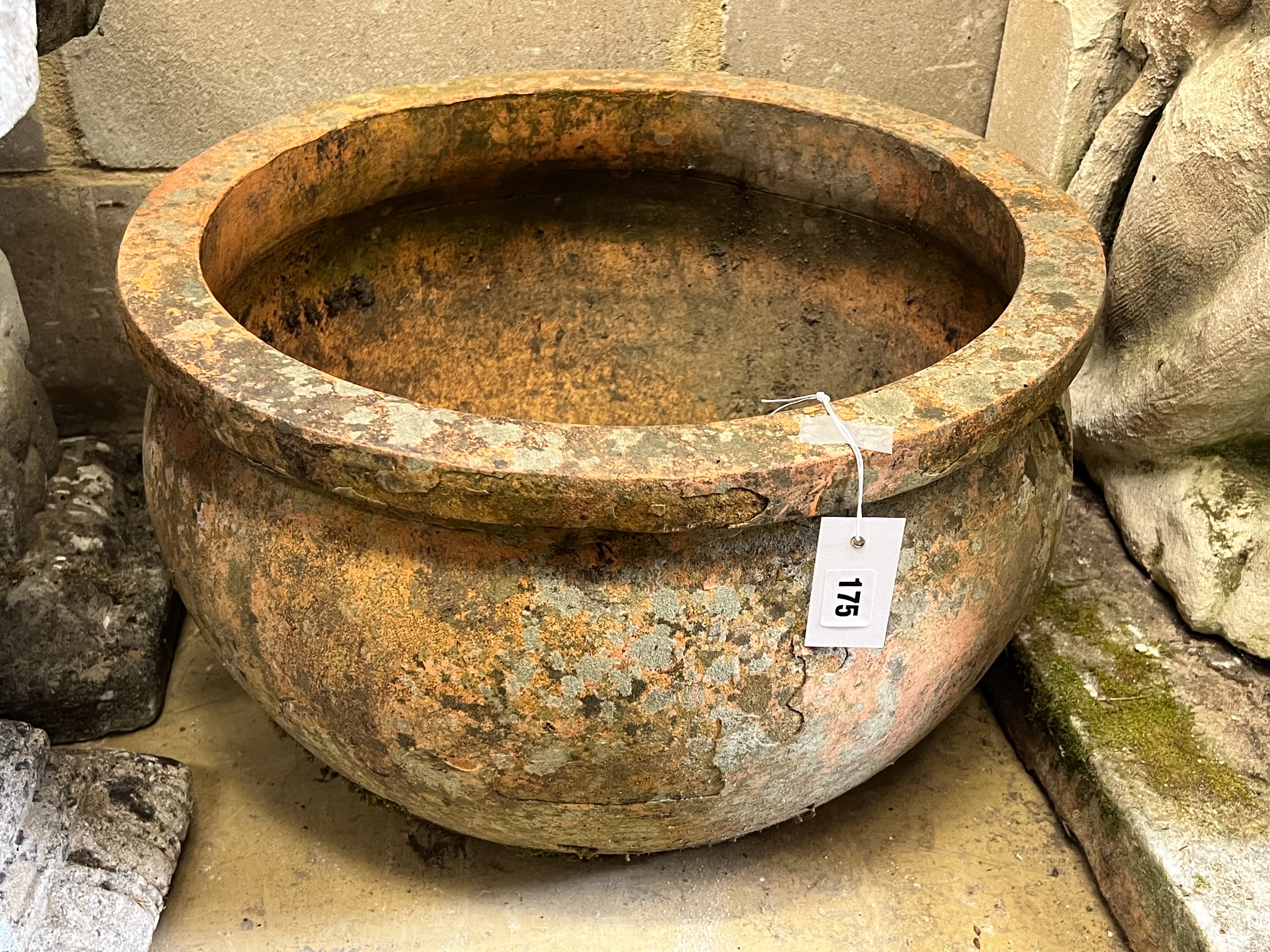 A circular terracotta garden planter, diameter 51cm height 31cm